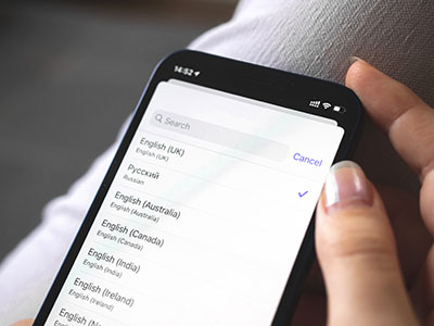 A smartphone screen displaying a list of languages to select from for school communication