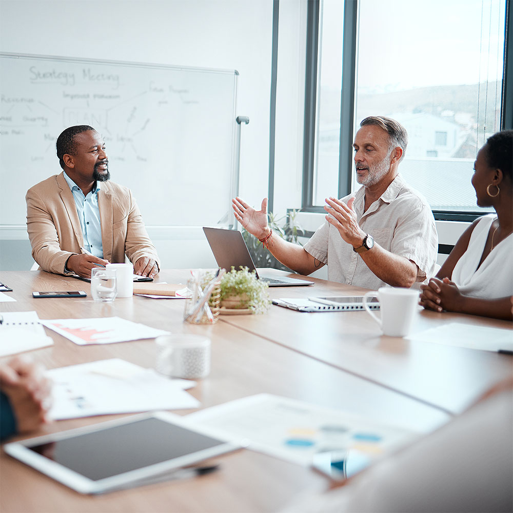 Group of diverse adults talking at table