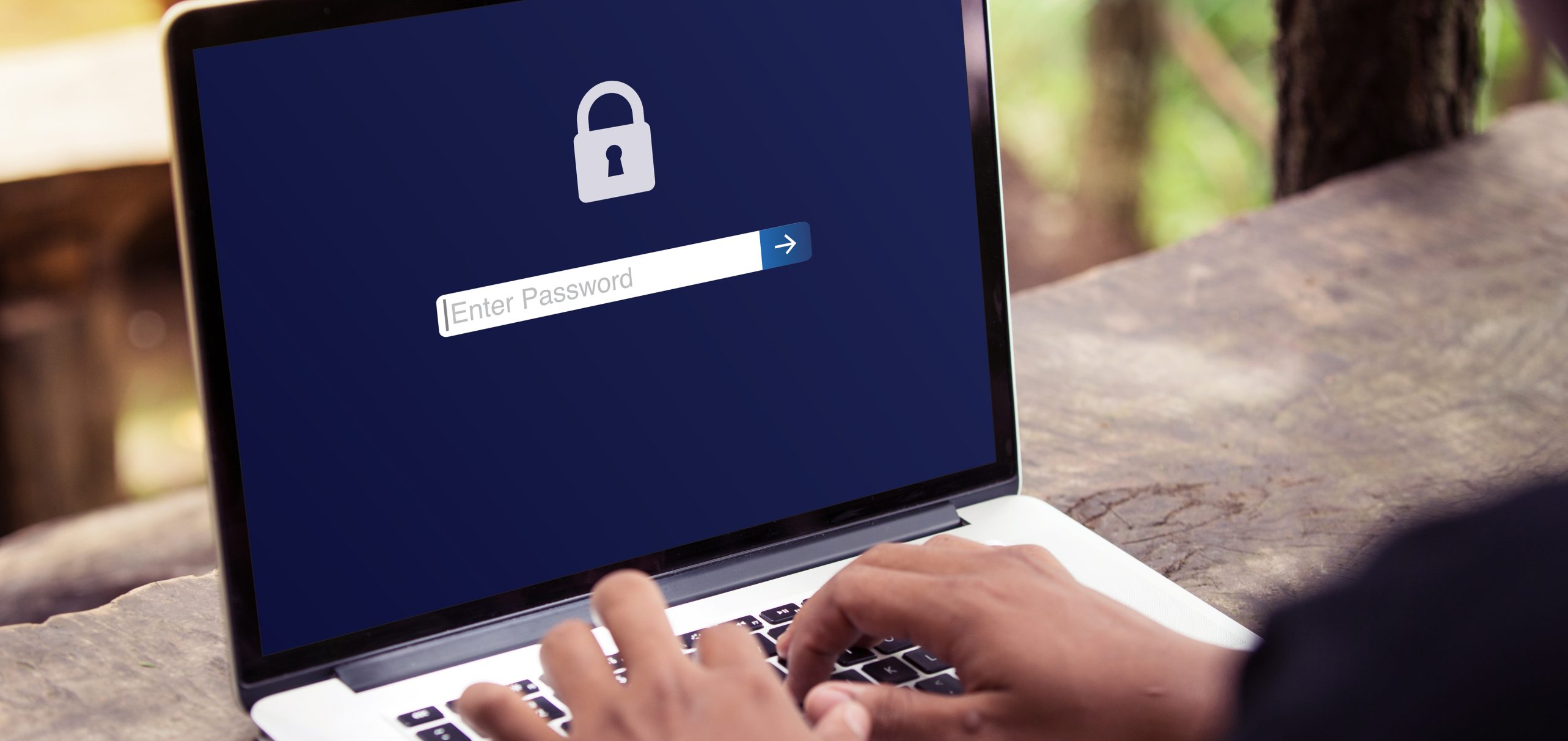 Laptop screen prompting person to enter a password
