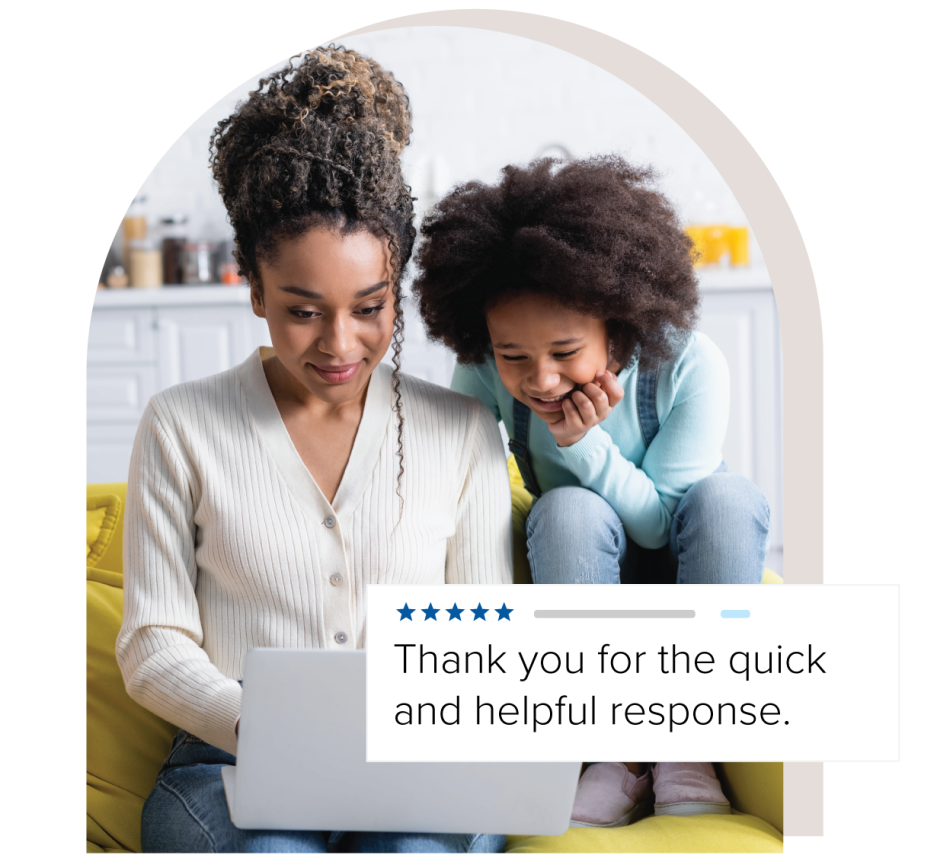 Mother and child looking at laptop together