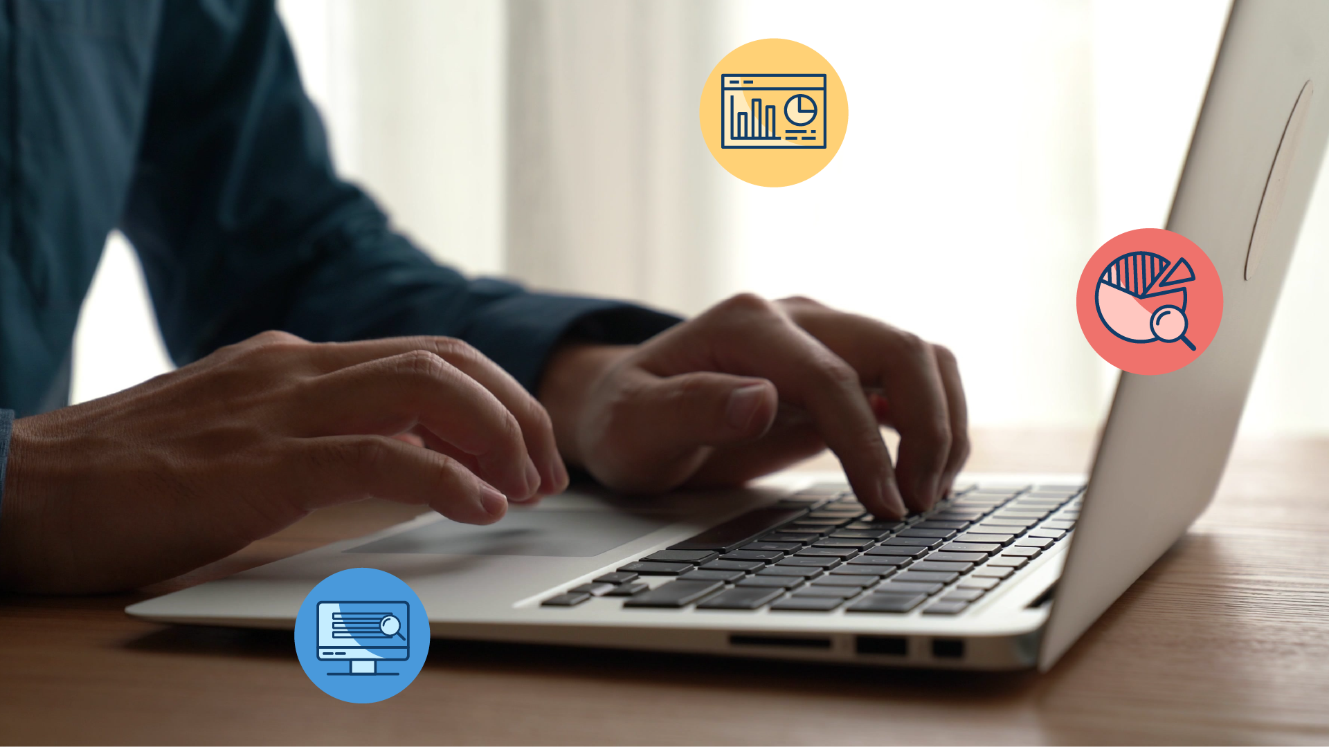 Close-up of man typing on a laptop