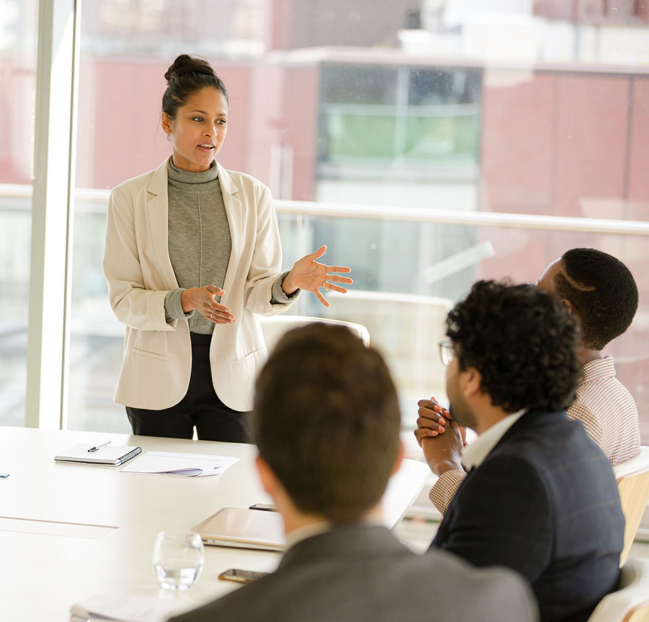 Businesswoman leading conference room meeting