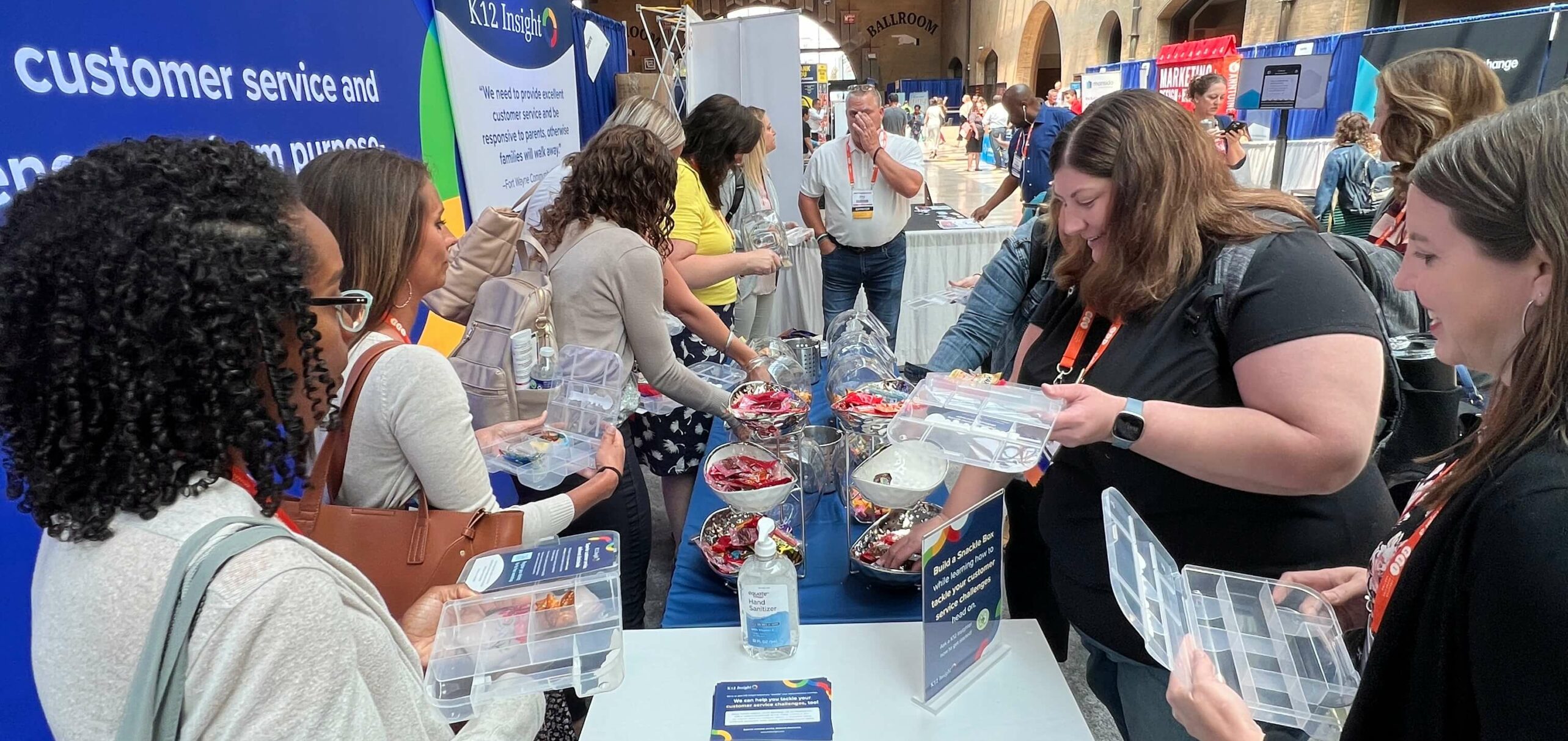 School PR pros building K12 Insight snackle boxes at the 2023 NSPRA seminar!