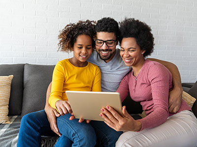 Black family studying and learning from home for online school during coronavirus