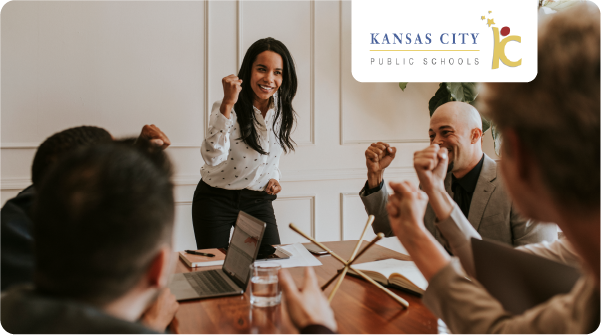 Kansas City public schools logo over an image of people celebrating a win at a board room